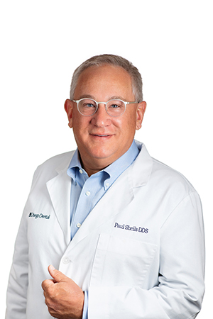 a man smiling, who is a Dentist at Otsego Dental, Paul Sheils