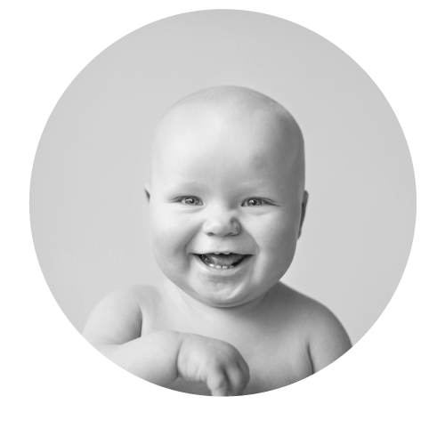 a cropped circle, with a baby in it smiling and laughing
