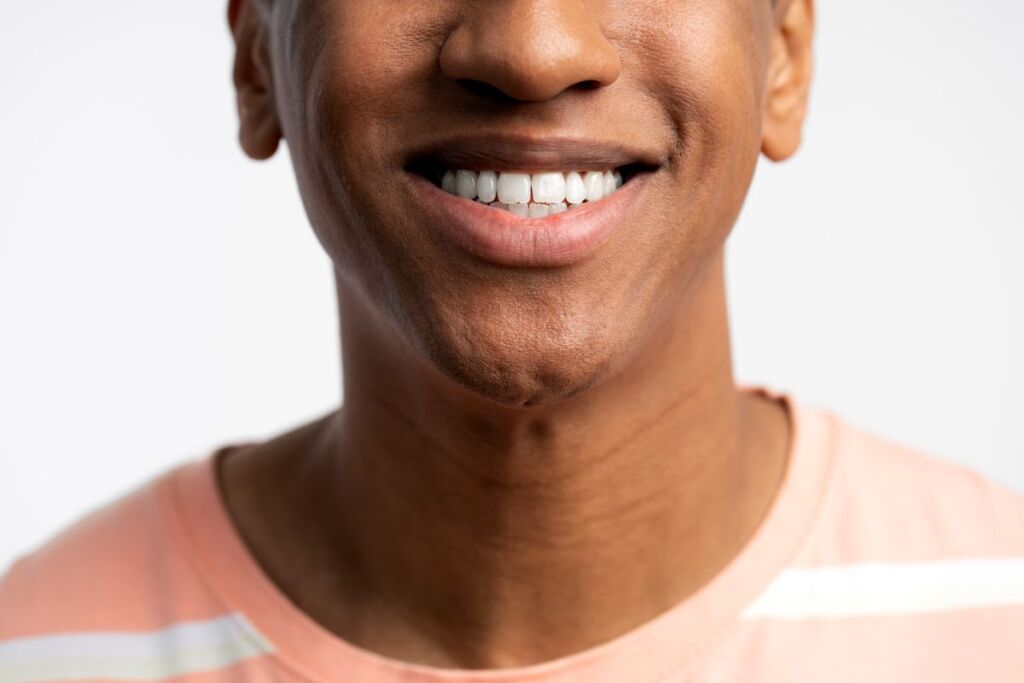 cropped view of young smiling latin man posing wit 2024 10 21 11 51 54 utc